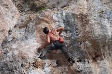 Rock Climber On Cliff Stock Image