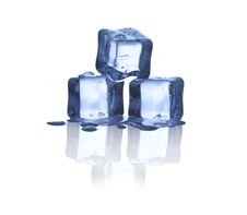 Ice Cubes On Glass Table. Stock Photo