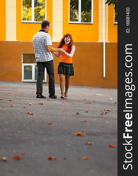 Happy couple walking in the city. Autumn. Happy couple walking in the city. Autumn