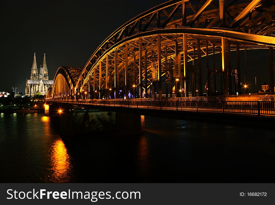 The famous Cologne (Germany) bridge from across the River Rhine at night. The famous Cologne (Germany) bridge from across the River Rhine at night