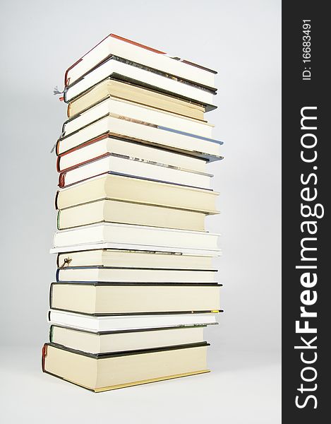 This image shows several books stacked and supported on the stack