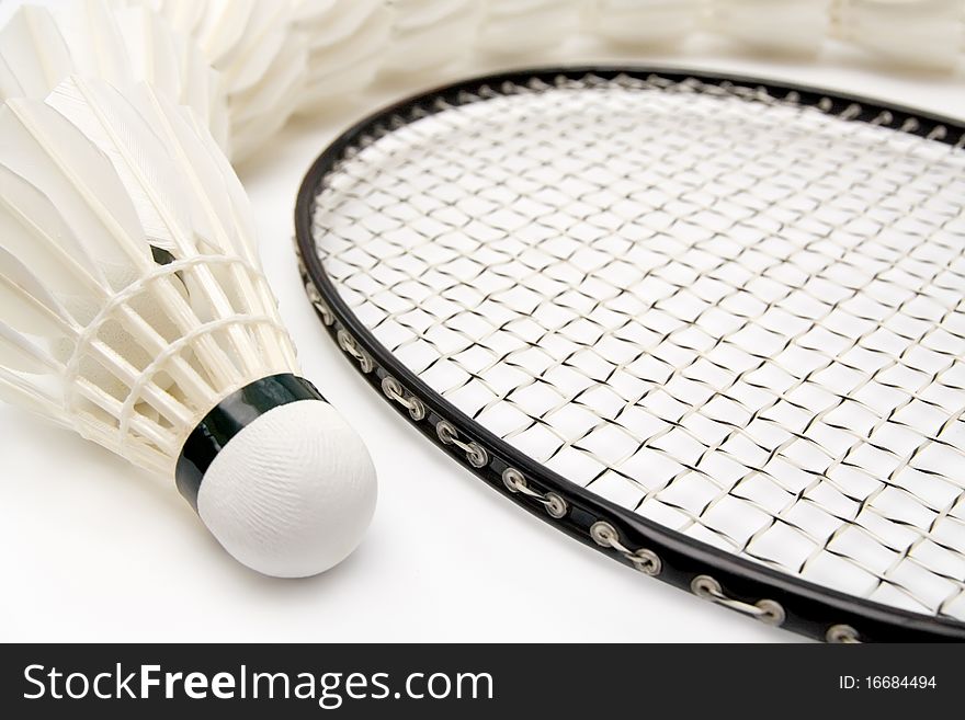 Row of shuttlecocks with badminton racket. Close-up. Row of shuttlecocks with badminton racket. Close-up