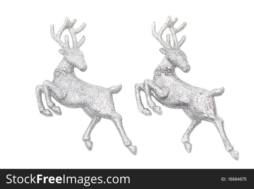 Christmas ornaments - two figures of glittering deer isolated on white. Christmas ornaments - two figures of glittering deer isolated on white