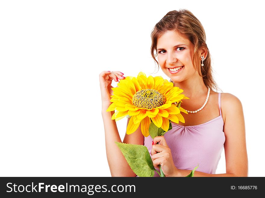 Portrait of a charming young woman in dress with sunflower