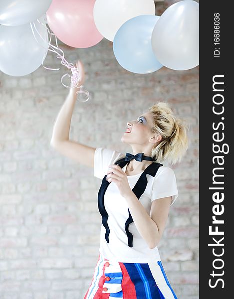 Attractive woman playing with balloons. Attractive woman playing with balloons