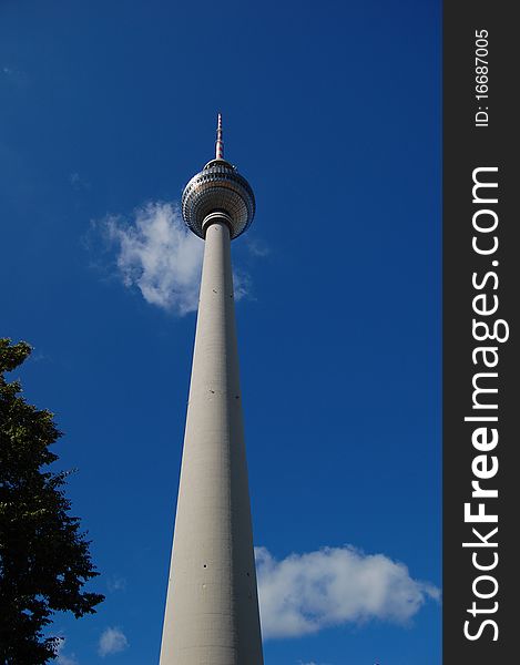 A television tower on the background of the clear blue sky in Berlin. A television tower on the background of the clear blue sky in Berlin