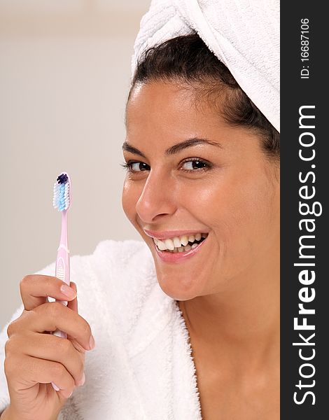 Beautiful brunette woman with a Toothbrush. Beautiful brunette woman with a Toothbrush