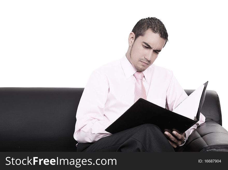 Young businessman analyzing a report in the office
