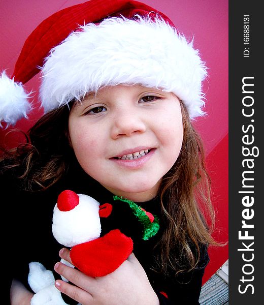 Happy christmas child wearing santa hat during holiday season