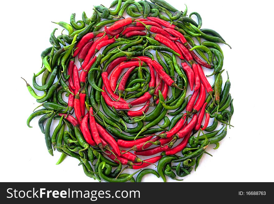 circle made of red and green chili peppers. circle made of red and green chili peppers