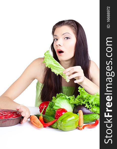 Young girl with vegetables over white background. Young girl with vegetables over white background