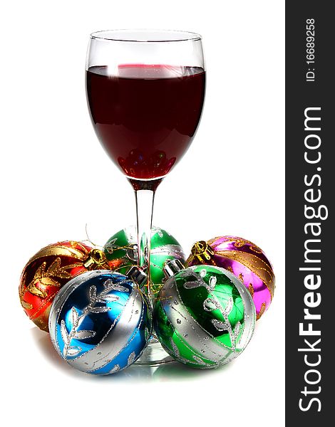 Glass of red wine and decoration for �hristmas isolated on white background