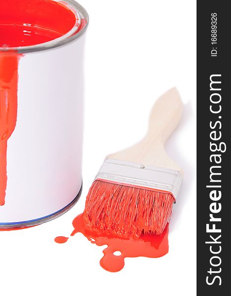 Brush with red paint thrown a bucket. Brush with red paint thrown a bucket