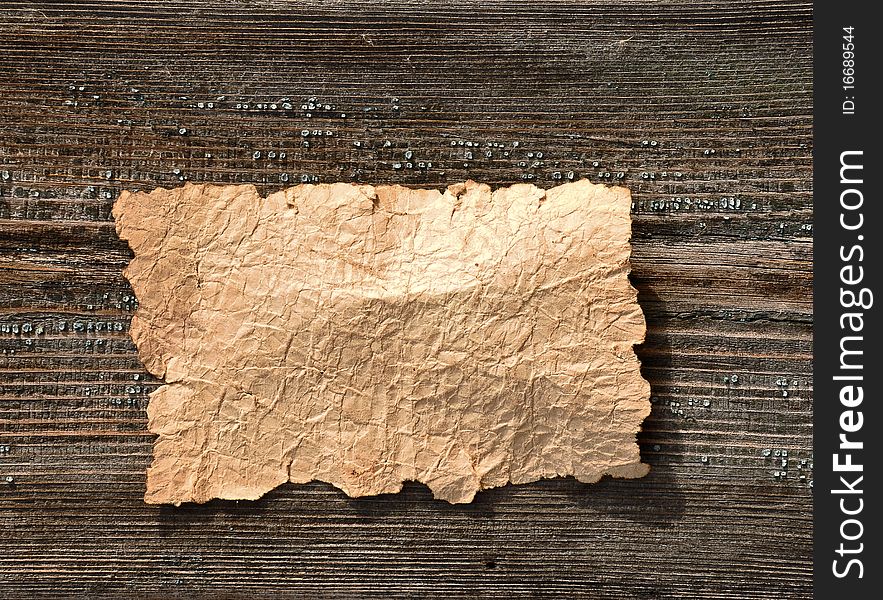 Old paper over an old wood background. Old paper over an old wood background