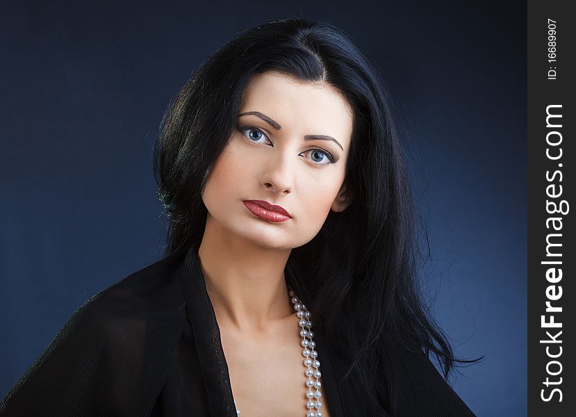 Portrait of elegant beautiful woman in shawl