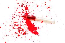Syringe With A Red Liquid And Stains Stock Photography Syringe With A Red Liquid And Stains Stock Photography