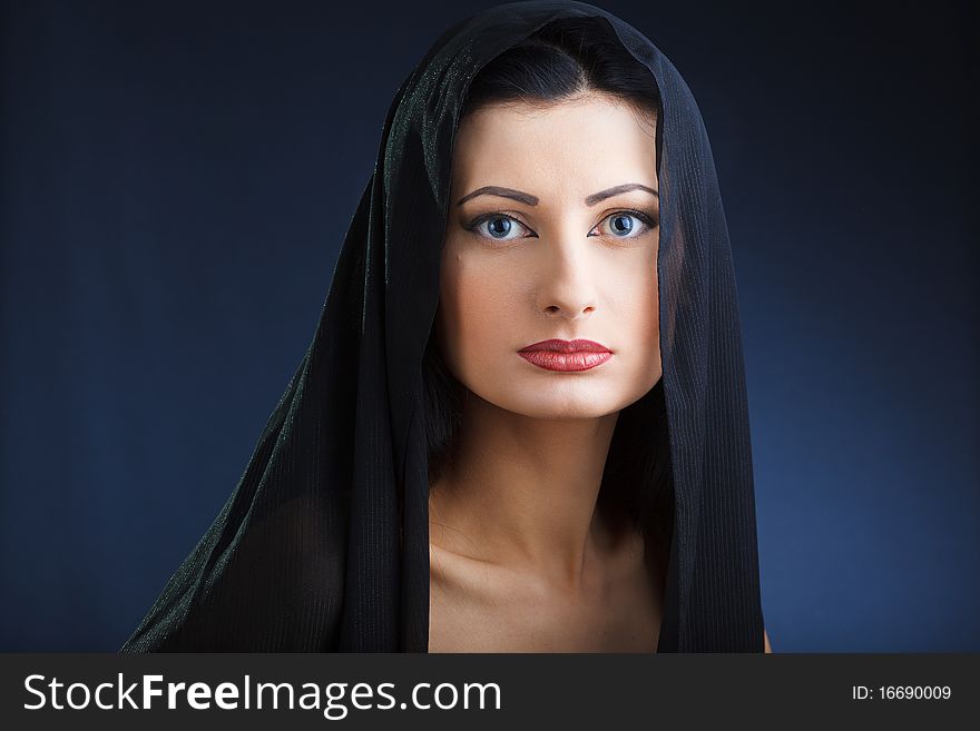 Portrait of elegant beautiful woman in shawl