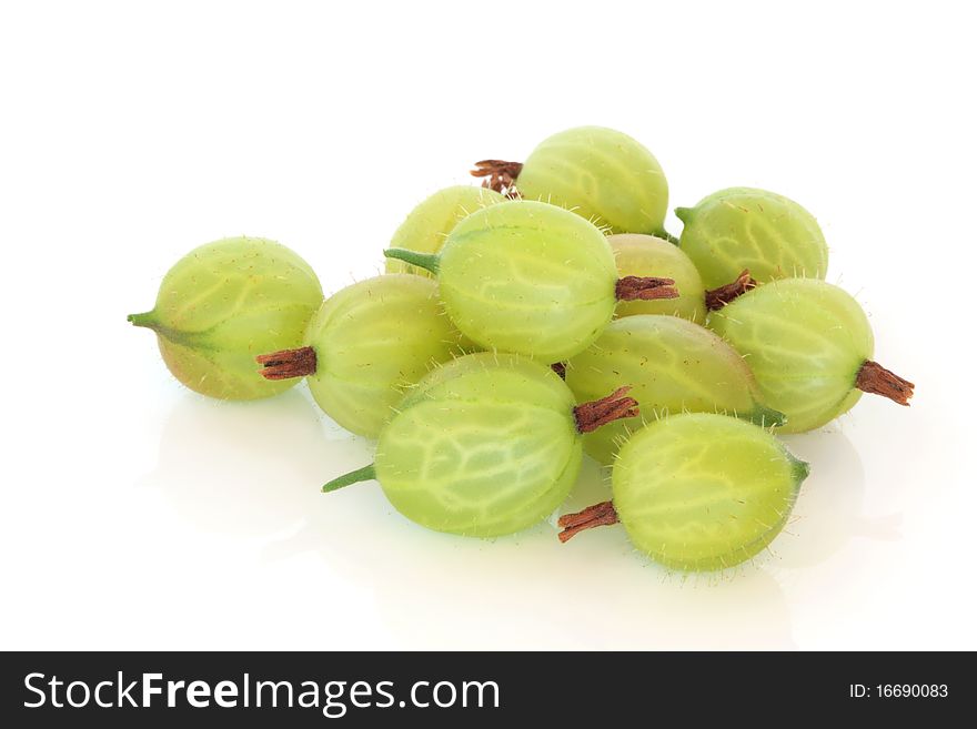 Gooseberries in a group isolated over white background with reflection. Gooseberries in a group isolated over white background with reflection.