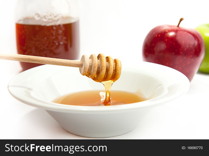 Plate With The Fresh Honey And Apples