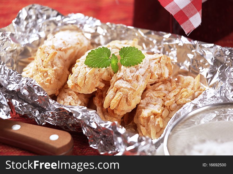 Almond treats in aluminum foil - closeup