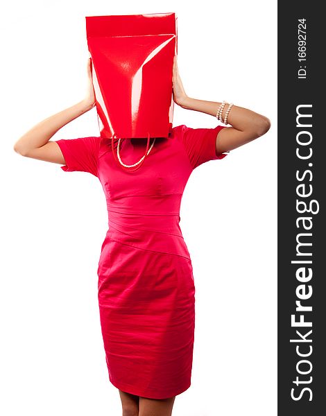 Woman in red drass with papper bag on her head. Woman in red drass with papper bag on her head