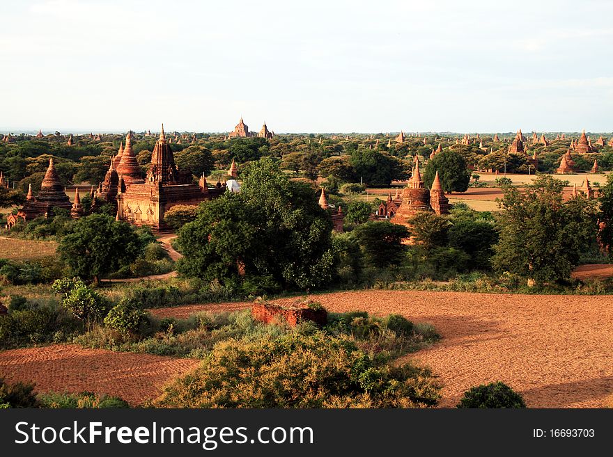 A panoramic view of the archaeological area of pagan in myanmar at sunset