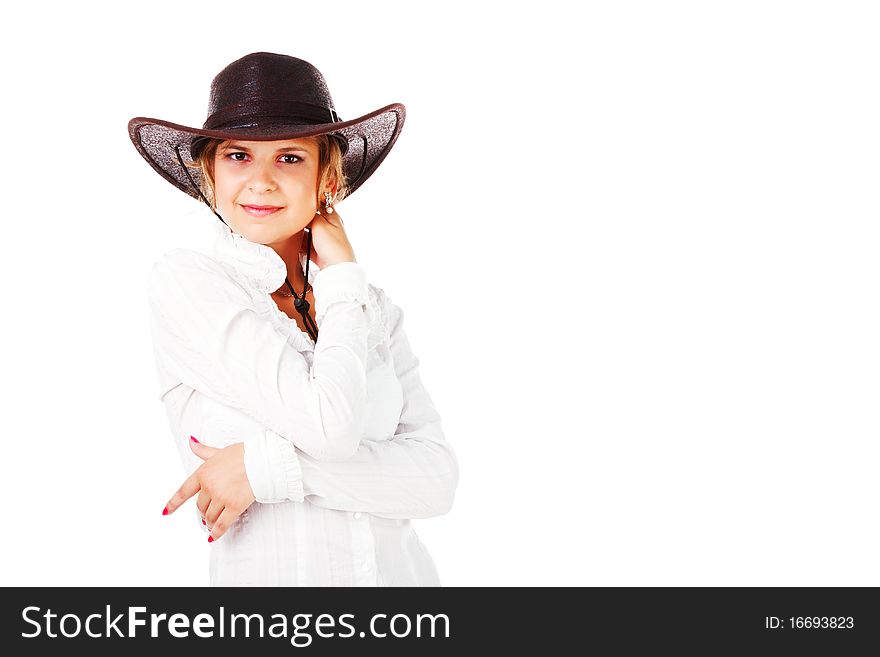 Portrait of a adorable young girl in cowboy hat on white background