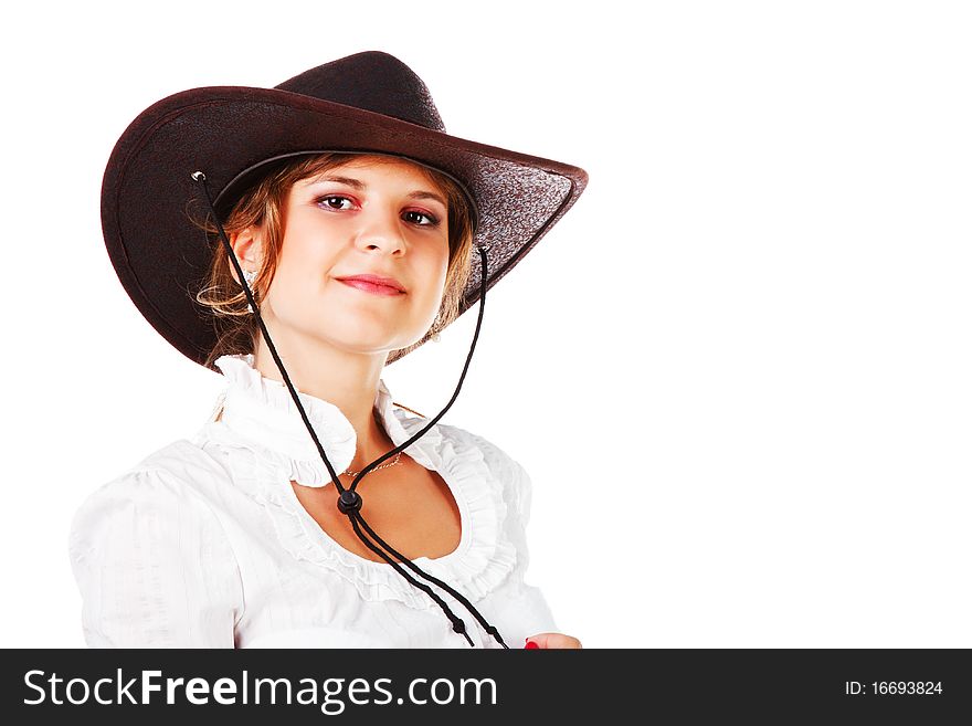 Portrait of a adorable young girl in cowboy hat on white background