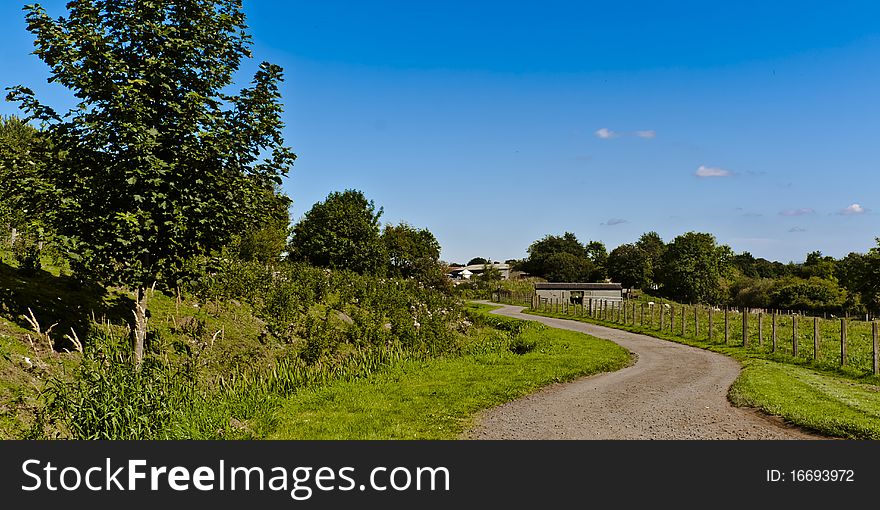 A shot taken of a winding path going through a country field. A shot taken of a winding path going through a country field