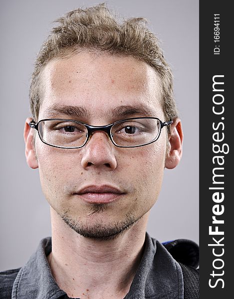 Skinny spectacles man portrait in studio. Skinny spectacles man portrait in studio