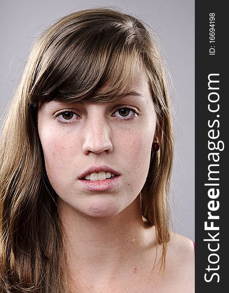 Beautiful portrait or a young brunette girl in studio. Beautiful portrait or a young brunette girl in studio