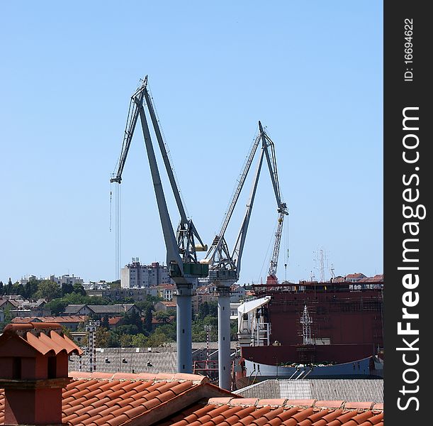 Marine cargo port. Cranes. Pula, Croatia. Marine cargo port. Cranes. Pula, Croatia