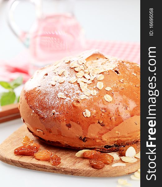 Loaf of sweet bread topped with rolled oats