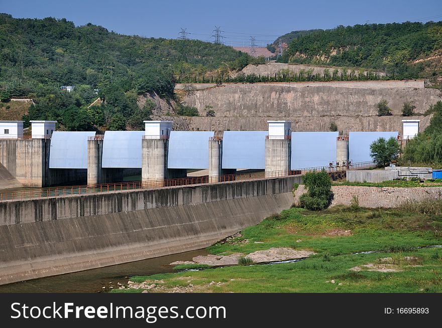 Gate of water in water electricity plant, as big construction made by concrete built beside river. Gate of water in water electricity plant, as big construction made by concrete built beside river.