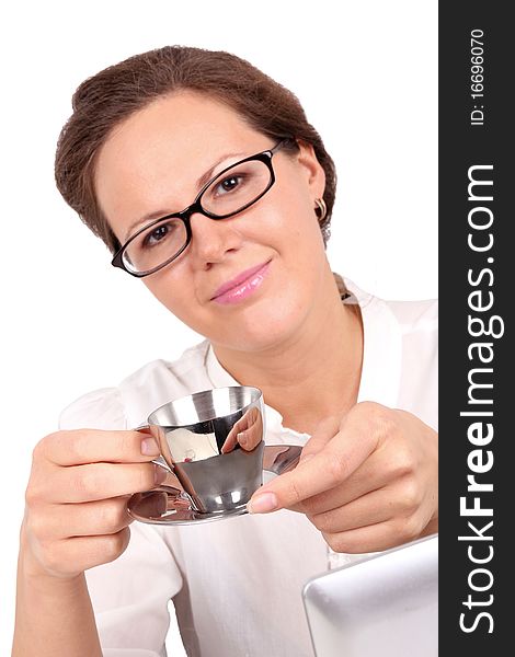 Businesswoman drinking a coffee, focus on hands and cup