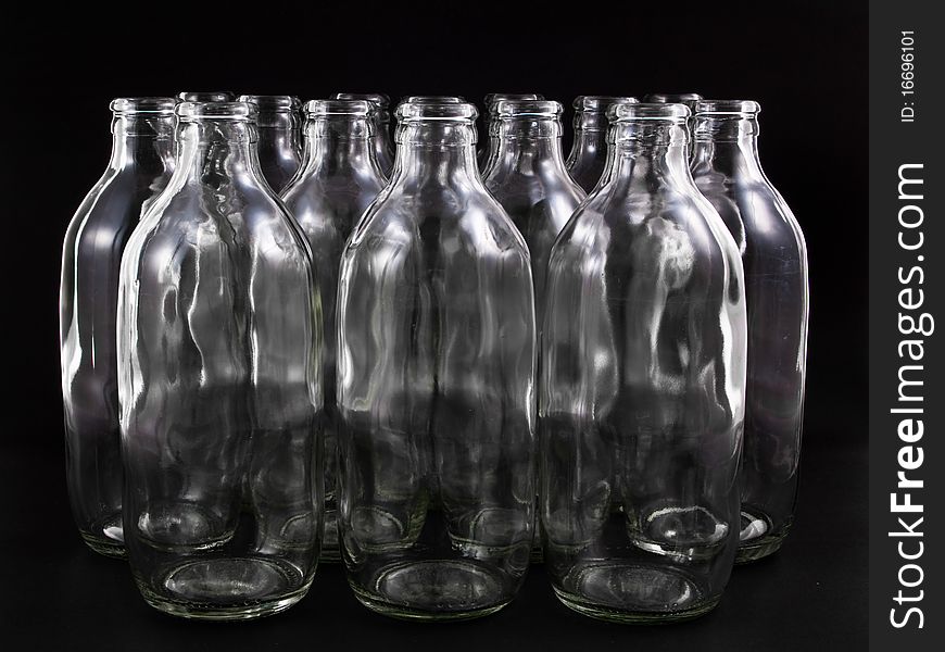 Empty bottles collection, colorless, isolated on black background