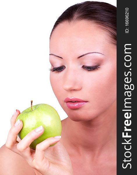 Woman Looking At Green Apple In Hand