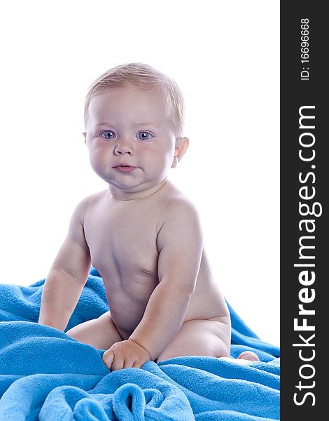 A beautiful baby with blue towel on white background
