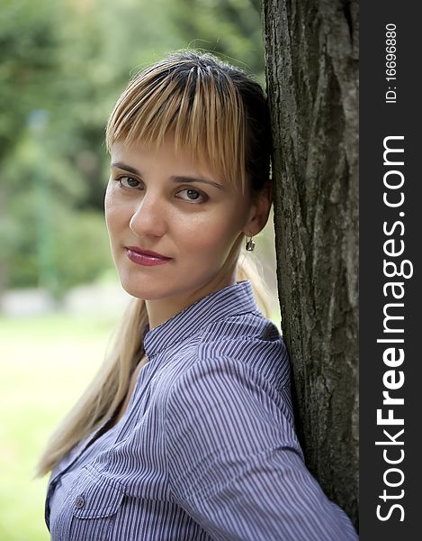 Portrait of an attractive young female in a park - Outdoor