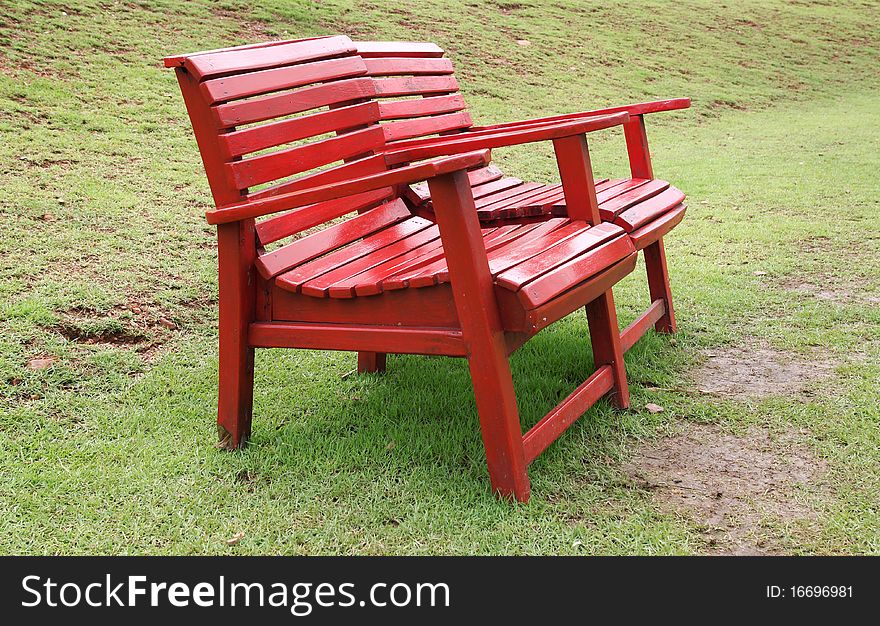 Two red chair on the yard. Two red chair on the yard