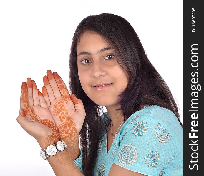 A smart Indian girl showing tattoo on her hands. A smart Indian girl showing tattoo on her hands.