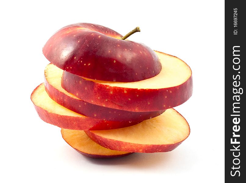 Chopped red apple slices on a white background