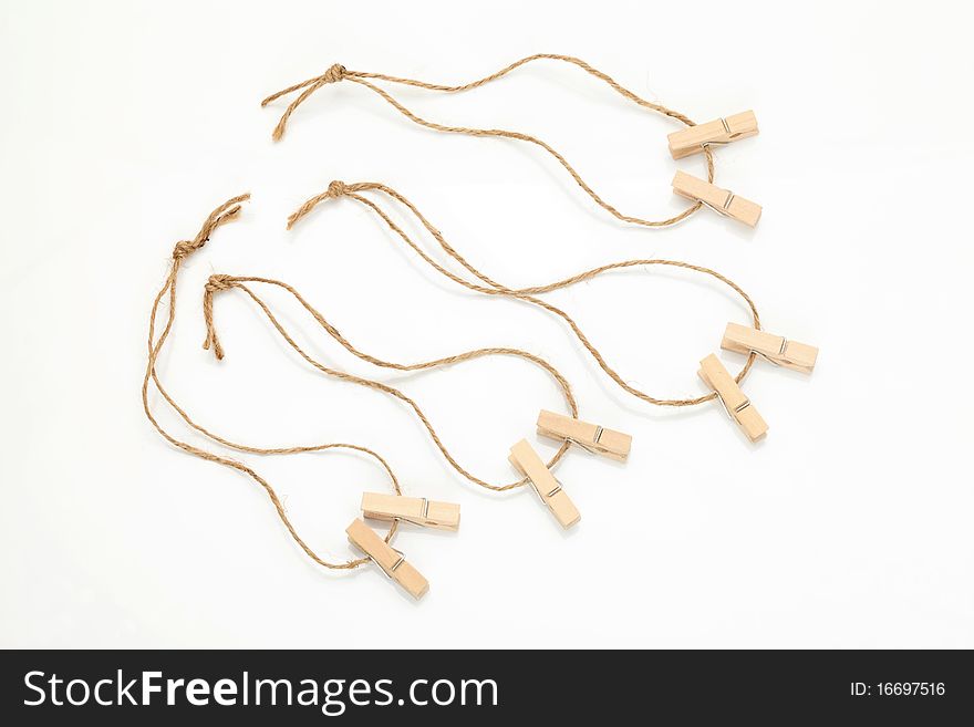 Wooden clothespins isolated on white background