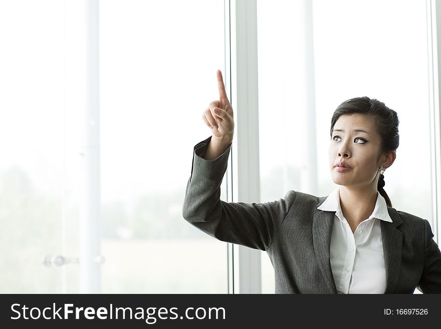 Businesswoman Pointing At Copy-space
