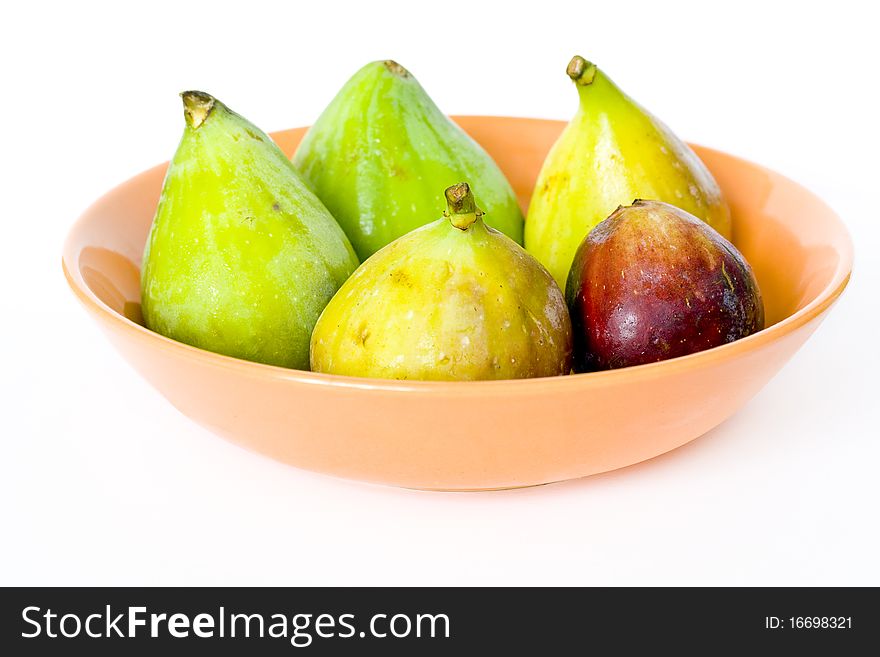 Figs on a plate, white background