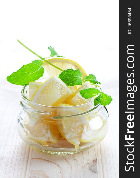 Sliced lemon in glass with mint. Sliced lemon in glass with mint