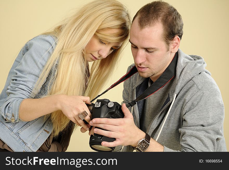 Student at photography analyzing photos with his colleague. Student at photography analyzing photos with his colleague