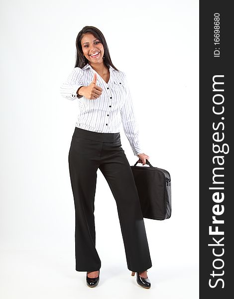Beautiful young business woman with big happy smile standing in a relaxed fun pose wearing heels holding laptop bag in one hand. Beautiful young business woman with big happy smile standing in a relaxed fun pose wearing heels holding laptop bag in one hand