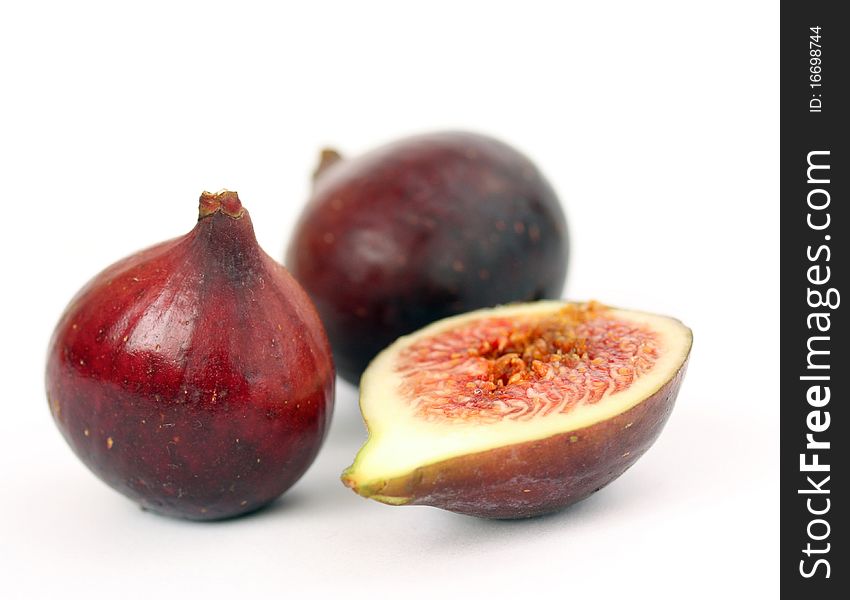 Three figs on white background