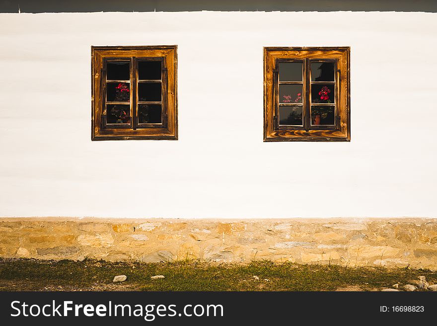Small wooden windows on a village house